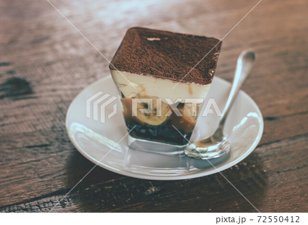 Close up view of Banoffee pie on the plate with wooden table. Close up view of Banoffee pie on the plate with wooden table. 72550412