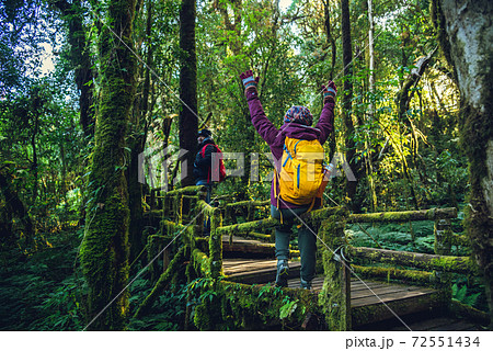 Couples traveling, relax in winter.Enjoy hiking walking travel to study nature in the rainforest. at the angka, Chiangmai 72551434