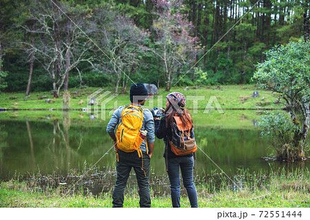 Asian couples, relax on holiday. travel nature taking photographs pink sakura. Asian couples, relax on holiday. travel nature taking photographs pink sakura. 72551444