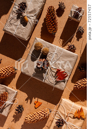 Zero waste Christmas knolling concept flat lay hard shadows. Hand craft eco gift natural New Year decorations top view. Zero waste Christmas knolling concept flat lay hard shadows. Hand craft eco gift natural New Year decorations top view. 72557457