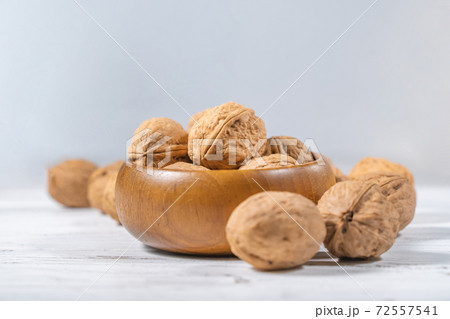 Walnuts kernels on white wooden desk, stock photo Walnuts kernels on white wooden desk, stock photo 72557541