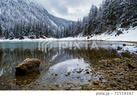 Green lake Gruner see cloudy winter day. Famous tourist destination. Green lake Gruner see cloudy winter day. Famous tourist destination. 72559397
