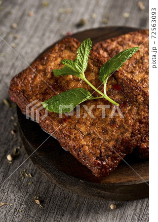 closeup of some cooked tofu fillets 72563093