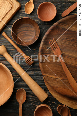 Different wooden kitchenware on wooden table, top view Different wooden kitchenware on wooden table, top view 72563456