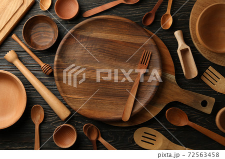 Different wooden kitchenware on wooden table, top view Different wooden kitchenware on wooden table, top view 72563458