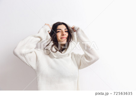 Portrait of beautiful woman isolated on white studio background. Comfort, warm in winter concept 72563635