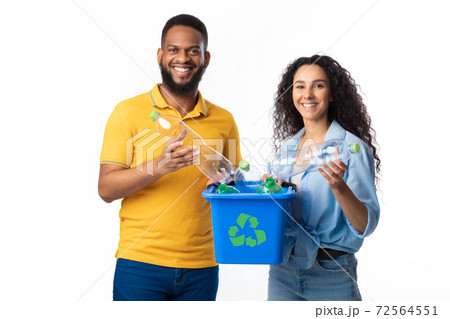 Diverse Couple Holding Box For Recycling Plastic Bottles, White Background Diverse Couple Holding Box For Recycling Plastic Bottles, White Background 72564551