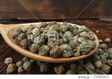 Macro photo of.green peppercorns on table Macro photo of.green peppercorns on table 72565627