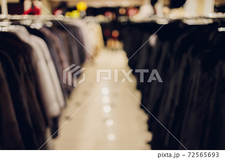 Background Blurred Defocused A row of vintage coats made of animal fur. 72565693