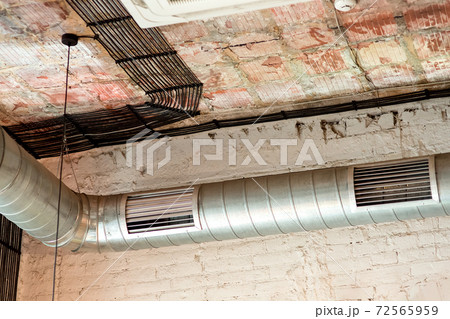 Pipes of the ventilation system of the restaurant room air conditioning in the loft style. Pipes of the ventilation system of the restaurant room air conditioning in the loft style. 72565959
