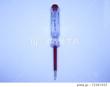 Selective focus of electric test pen screwdriver and voltage detector probe isolated on white background. Selective focus of electric test pen screwdriver and voltage detector probe isolated on white background. 72567455