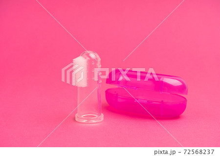 Compact toothbrush fingertip. Travel hygiene close up 72568237
