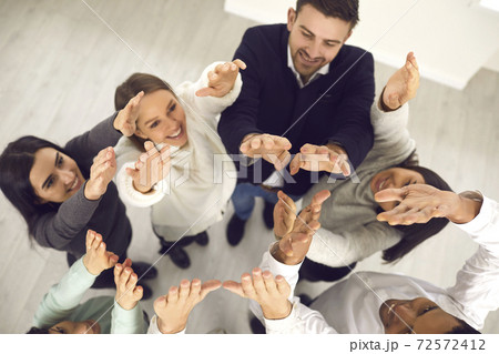 Business people raising hands up in air, illustrating concept of team aspiring for success Business people raising hands up in air, illustrating concept of team aspiring for success 72572412