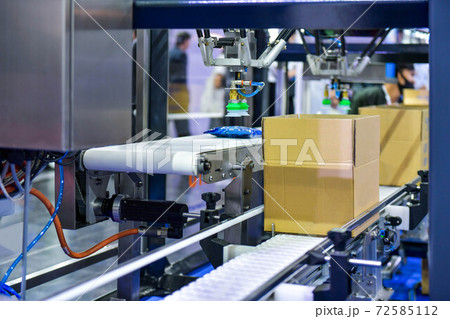 cardboard boxes on conveyor belt. parcels transportation system concept cardboard boxes on conveyor belt. parcels transportation system concept 72585112