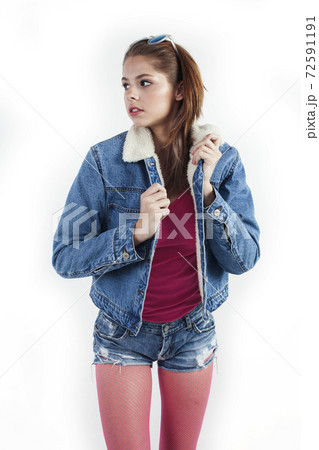 young pretty stylish brunette hipster girl posing emotional isolated on white background happy smiling cool smile, lifestyle people concept 72591191