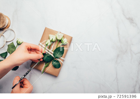 Eco friendly gift wrapped in brown paper 72591396