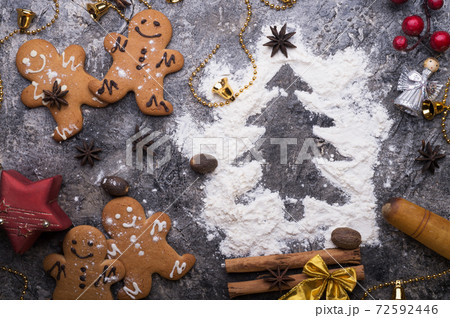 christmas decorative cookies with flour christmas tree. christmas background around grey background 72592446