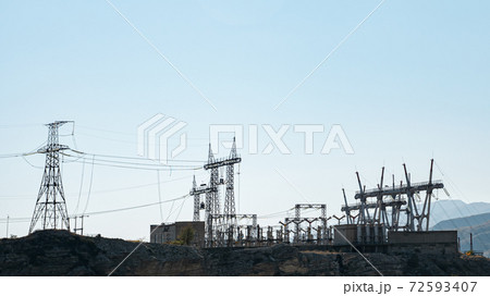 Silhouettes of power transmission lines at substation Silhouettes of power transmission lines at substation 72593407