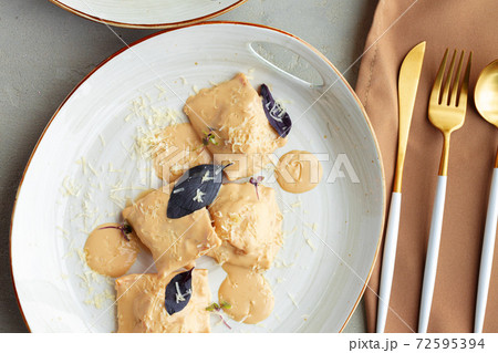 Russian dumplings with mushroom sauce and basil Russian dumplings with mushroom sauce and basil 72595394