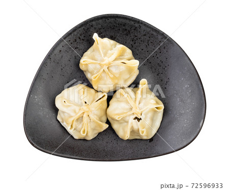 top view of steamed Buuz on black plate isolated 72596933