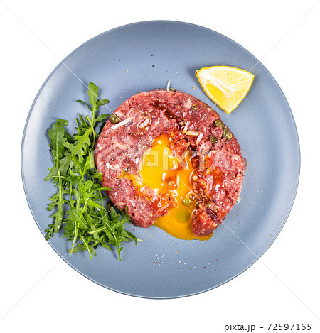 top view of served Steak tartare on blue plate top view of served Steak tartare on blue plate 72597165