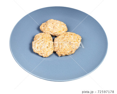 steamed red fish cutlets on blue plate isolated steamed red fish cutlets on blue plate isolated 72597178