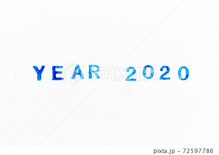 Blue color ink of rubber stamp in word year 2020 on white paper background 72597786