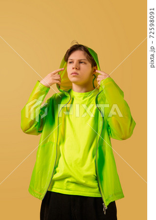 Old-school fashioned young man dancing isolated on yellow background Old-school fashioned young man dancing isolated on yellow background 72598091