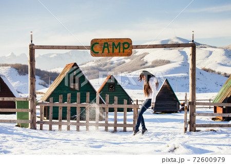 woman play with snow at ski resort camp 72600979
