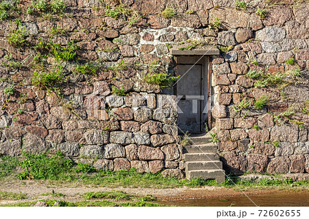 Door in a stone wall. Door in a stone wall. 72602655