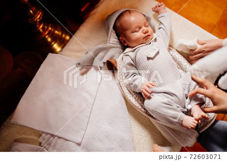 the baby dress up in clothes on the table in the Church. ordinance of baptism. the baby dress up in clothes on the table in the Church. ordinance of baptism. 72603071