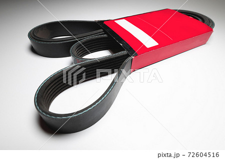 Wide poly-V bypass belt for internal combustion engine attachments in red carton. New spare alternator belt Wide poly-V bypass belt for internal combustion engine attachments in red carton. New spare alternator belt 72604516
