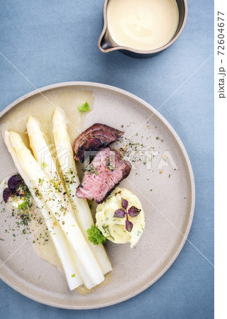 barbecue dry aged sliced fillet steak with white asparagus in butter sauce and mashed potatoes barbecue dry aged sliced fillet steak with white asparagus in butter sauce and mashed potatoes 72604677