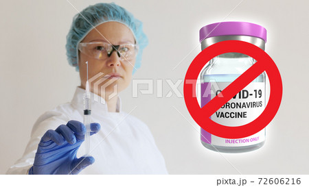 Nurse with injection in hand and coronavirus vaccine dose no vaccination 72606216