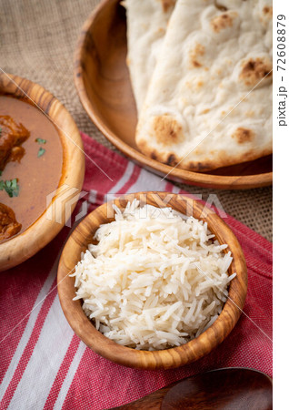 basmati rice in wooden bowl 72608879
