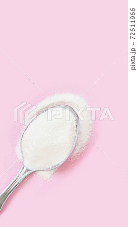 Collagen white powder. Pastel color background. Health product 72611966
