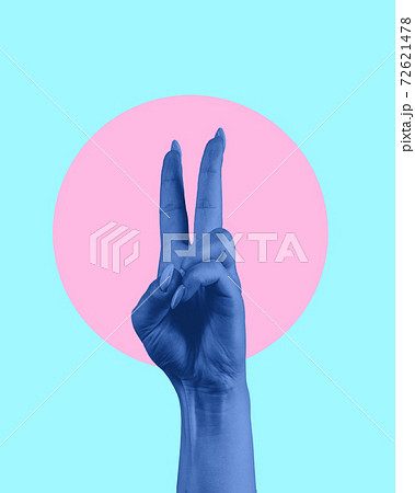Contemporary art collage. Blue human hand showing victory sign. 72621478