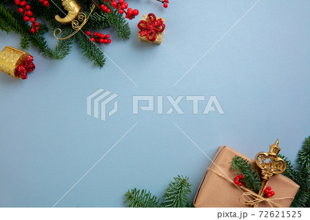 Holiday decorations on blue background top view. Christmas greeting card 72621525