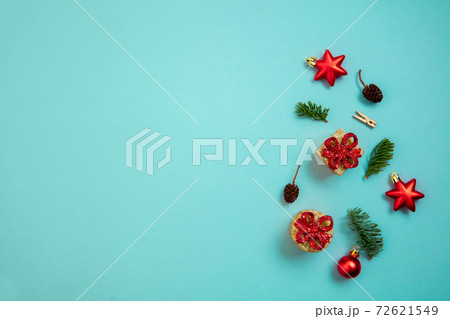 Holiday decorations on blue background top view. Christmas greeting card 72621549