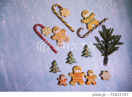 Gingerbread men walk through the forest and ride downhill observing a social distance. the concept of safety in the period of coronovirus 72622107