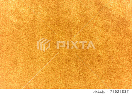 Abstract texture of brown paper on window in sunlight behind. 72622837