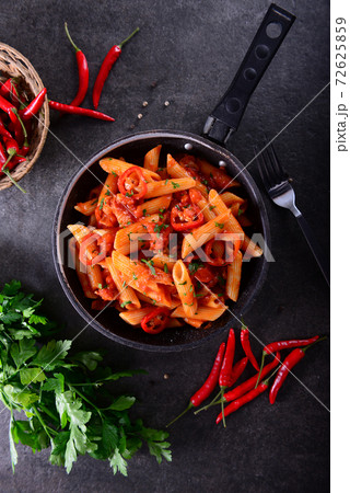 Penne pasta with chili sauce arrabiata 72625859