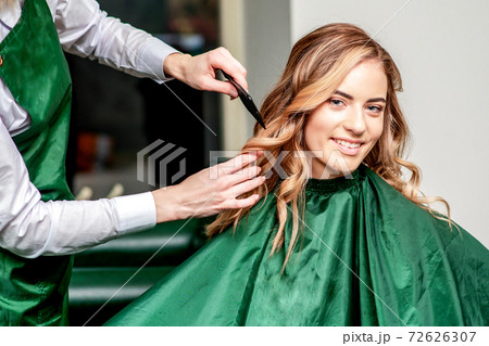 Girl receives combing hair. Girl receives combing hair. 72626307