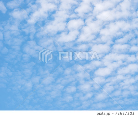 Blue sky with soft clouds background Blue sky with soft clouds background 72627203