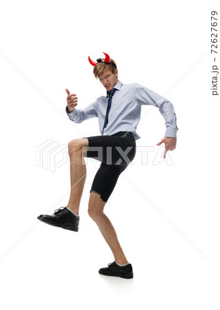 Happy young man dancing in casual clothes or suit, remaking legendary moves of celebrity from culture history 72627679