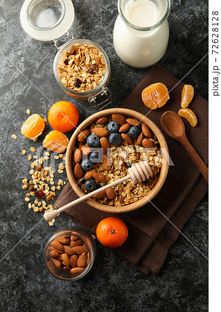 Concept of tasty breakfast with granola on black smokey background Concept of tasty breakfast with granola on black smokey background 72628128