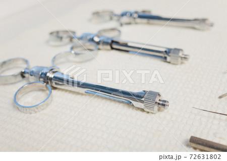 Set of metallic dentist tools. Dentist choses metal head for dentist s drill. Dentist clinic. 72631802
