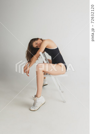Beautiful young woman's portrait isolated on grey studio background. Having fun, happy, full length Beautiful young woman's portrait isolated on grey studio background. Having fun, happy, full length 72632120