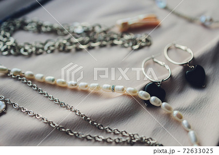 White pearls on the white silk as wedding background. White pearls on the white silk as wedding background. 72633025