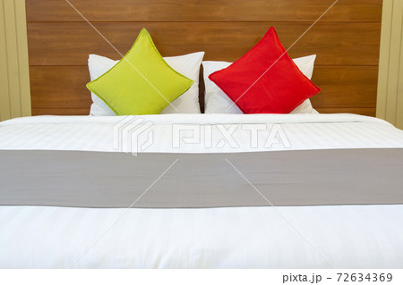 Modern bedroom interior with colorful pillow on bed Modern bedroom interior with colorful pillow on bed 72634369